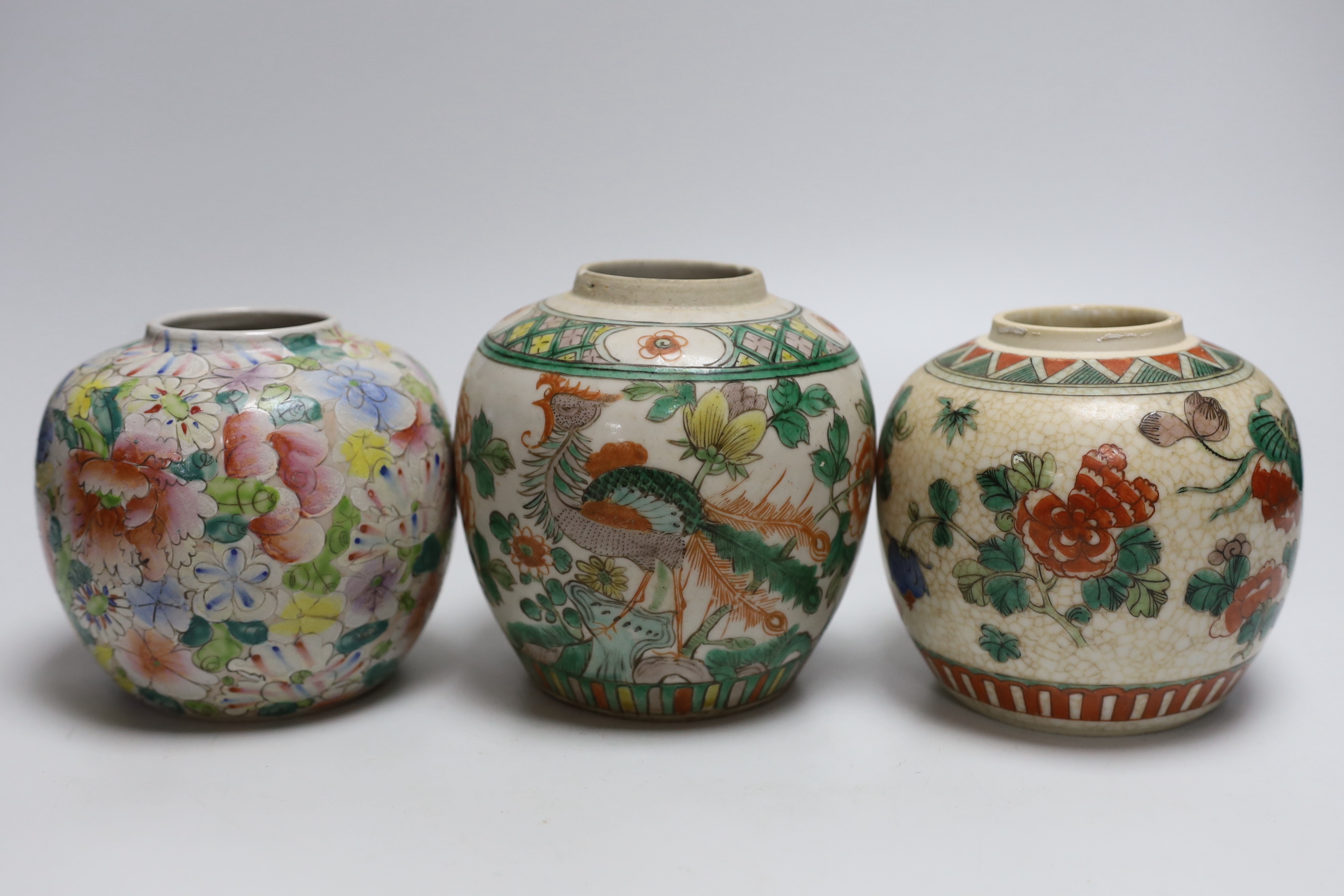 Five Chinese enamelled porcelain ginger jars, one with a cover, tallest 12cm high